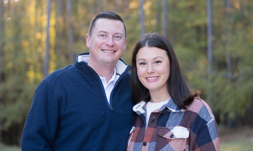 Jared Smith outdoors with his wife