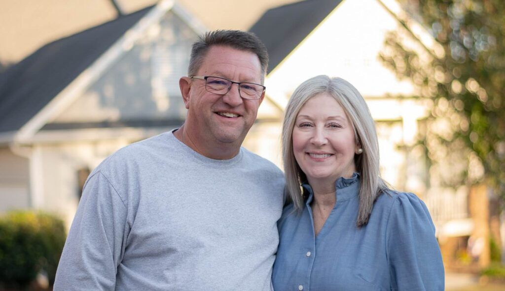 Jared Wyatt outdoors with his wife